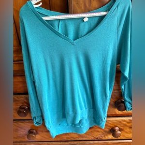 Turquoise TNA long sleeve tshirt size medium